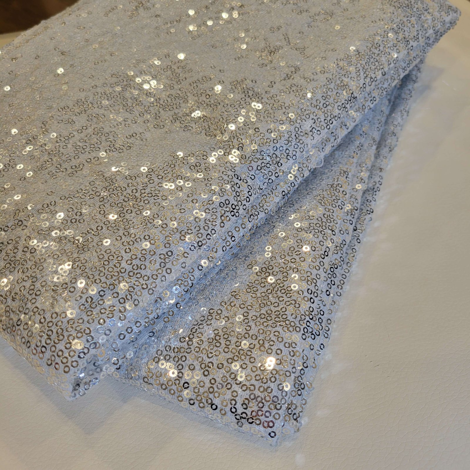 Silver sequin photo booth backdrop for modern parties